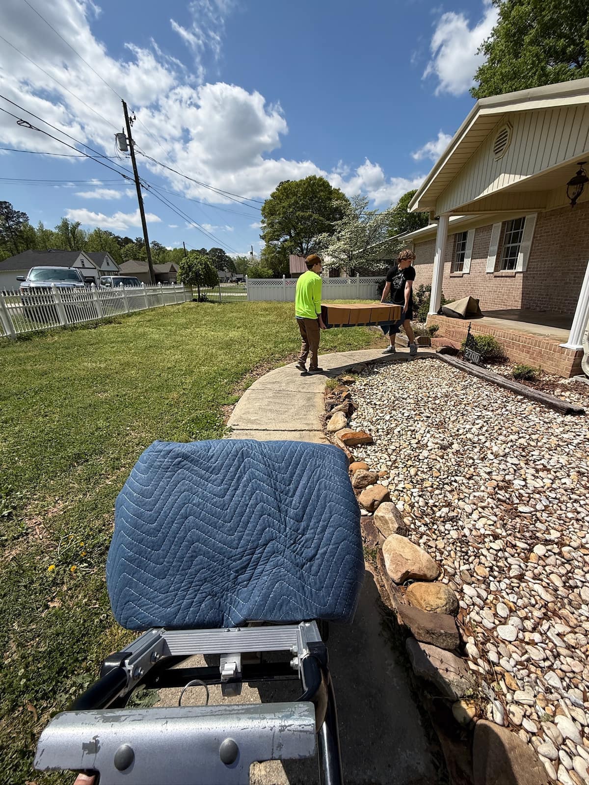 Mover carrying furniture during a labor-only job