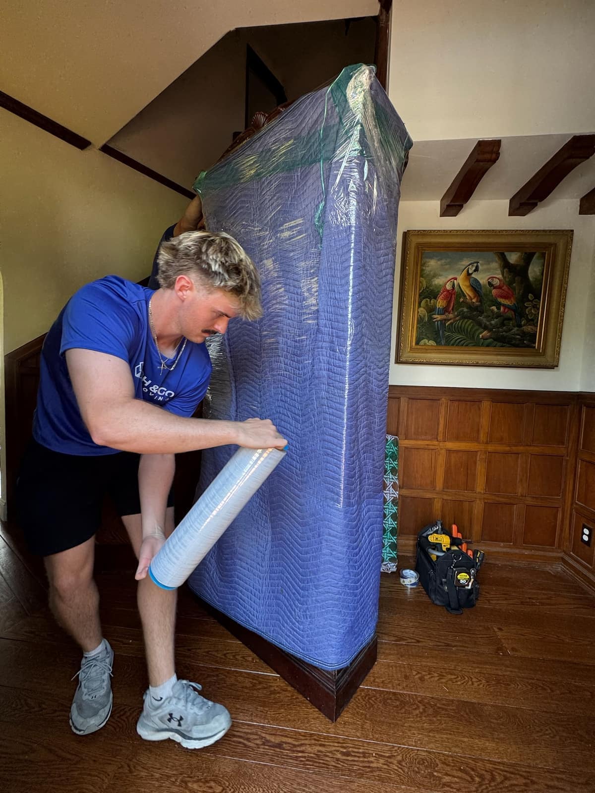 Stash & Go mover carefully wrapping furniture on a customer job
